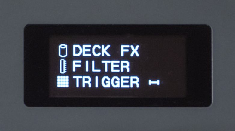 Close-up of Serato SLAB, a Studio-native MIDI pad controller showing dynamic LED display.