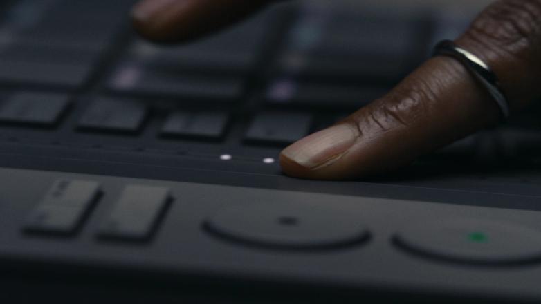 Close-up of Serato SLAB, a Studio-native MIDI pad controller showing touch strip.