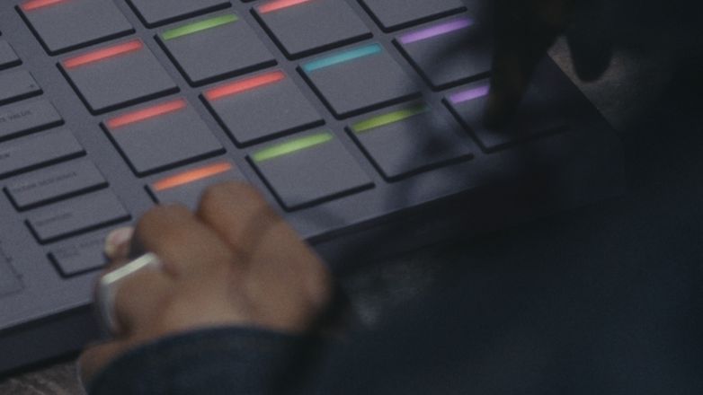 Close-up of Serato SLAB, a Studio-native MIDI pad controller, showing the Note Repeat feature.